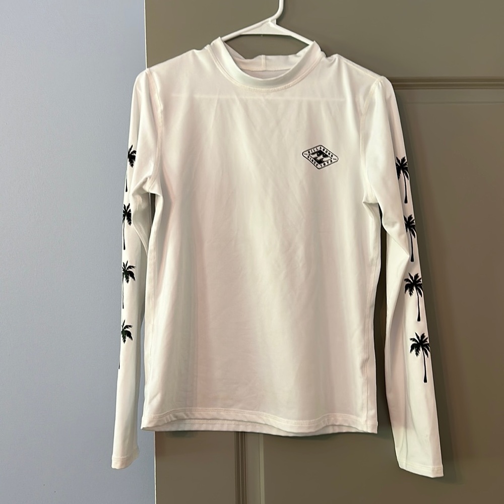 Women’s white Billabong long sleeve rash guard with palm trees UV protection